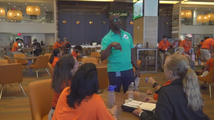 Miami Dade College professor finds his passion with side job at Hard Rock Stadium — CBS Miami, Parkland Arts news